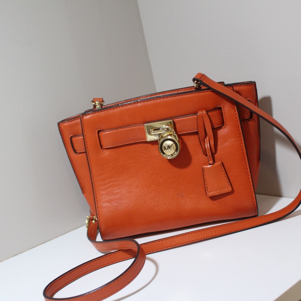 Micheal Kors medium orange clutch!